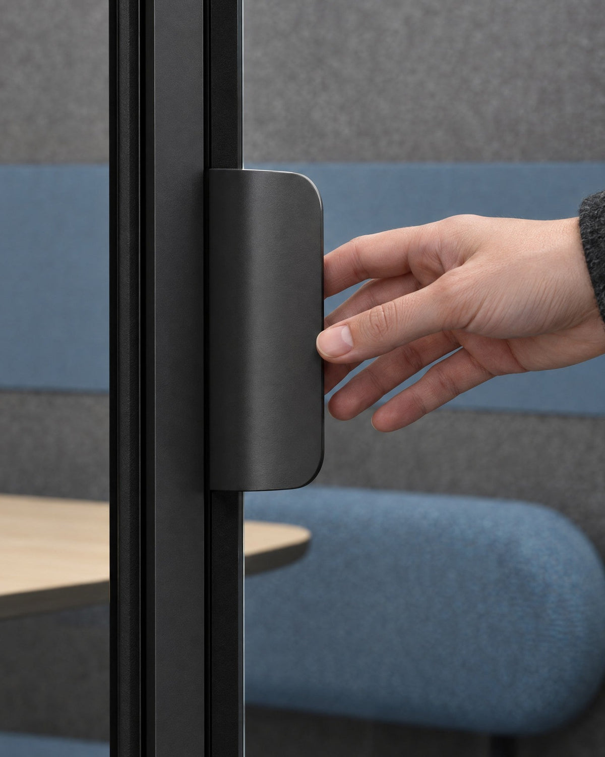 Hand opening the centre glass door of a SoundBox VRS Double by its flat dark satin pull. Illustration.