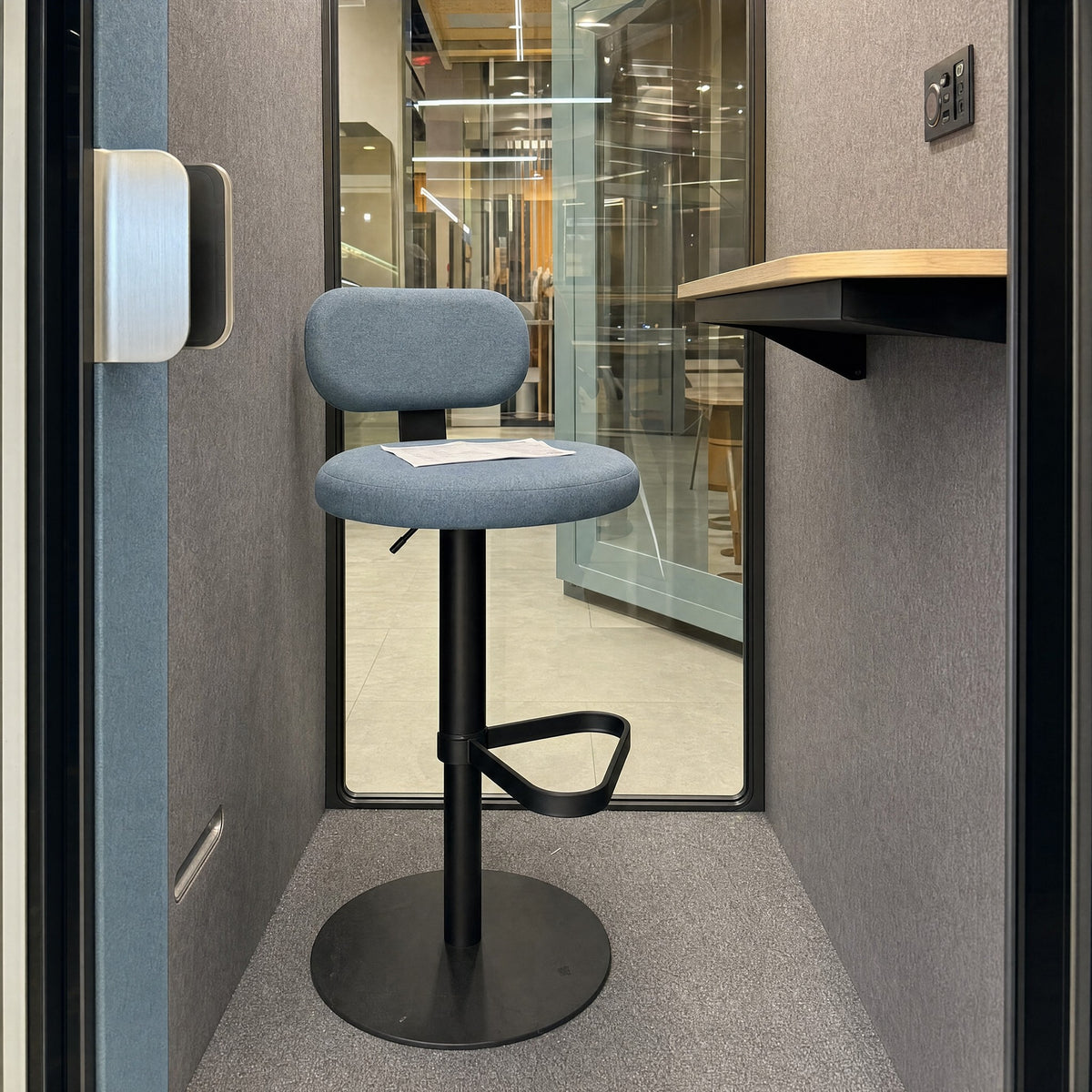 Blue stool with footrest and round base inside the SoundBox VRS Single