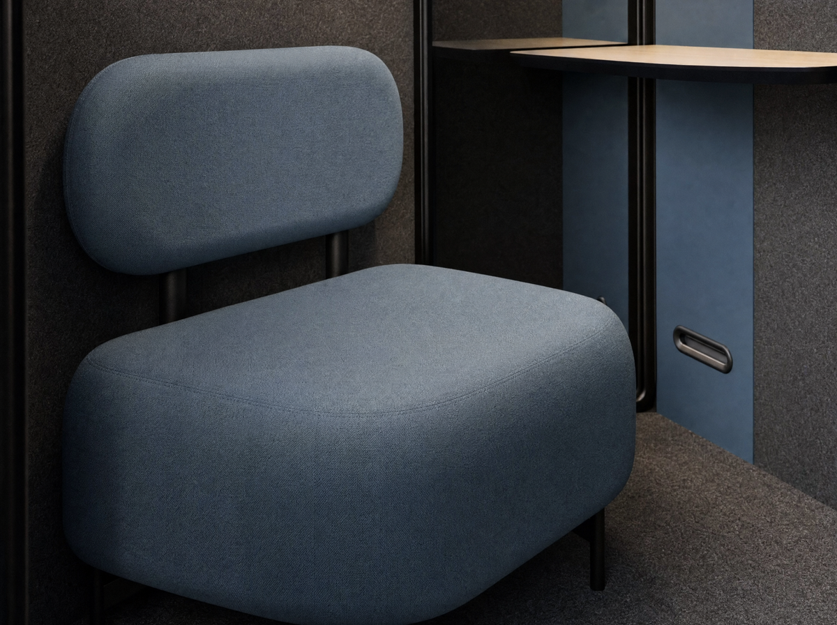 Blue upholstered comfort seat inside a SoundBox VRS pod