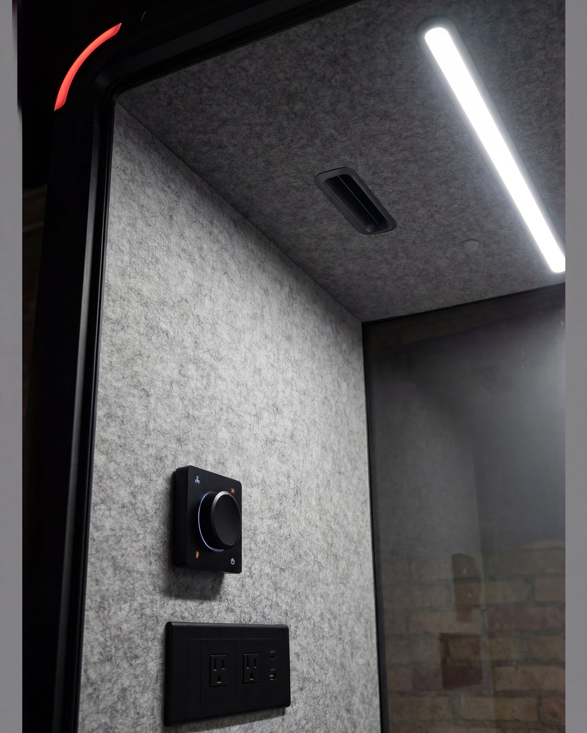 Inside the Single Work Booth: ceiling light strip, vent, climate dial and outlets, all within reach of the stool ::inside