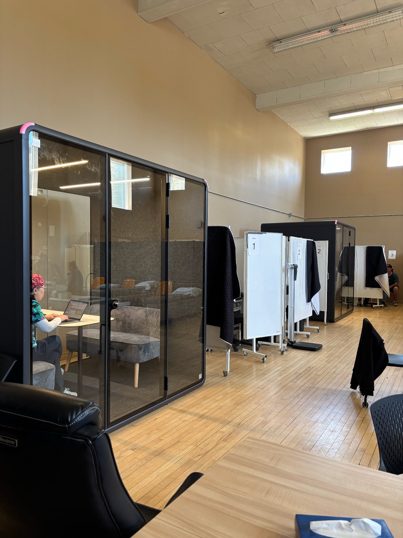 Two Quiet Cabins booths in active use on the program floor at CMHA Durham's Yes Collaborative site
