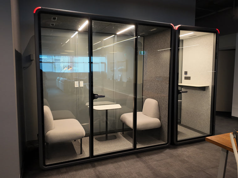 A Quiet Cabins Double and Single installed side by side on a corporate floor