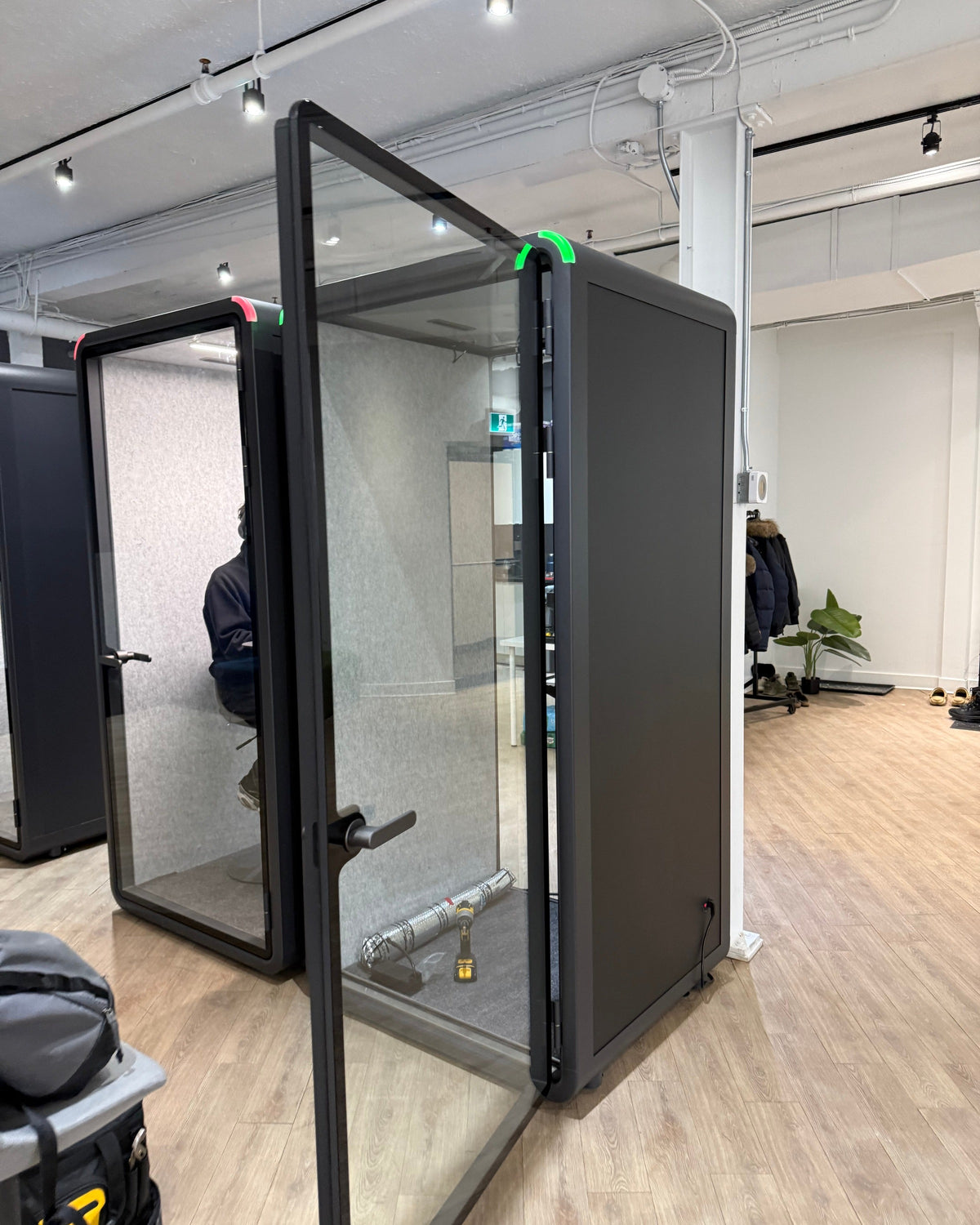 Single Work Booth with the door swung fully open during setup at a Toronto office ::real