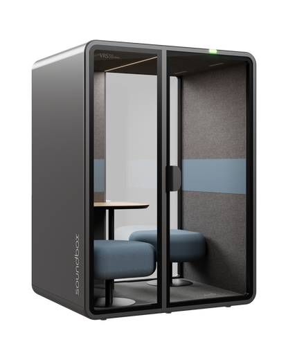 SoundBox VRS Comfort pod: graphite shell, two glass front panels, two dusty blue seats and a small oak table inside