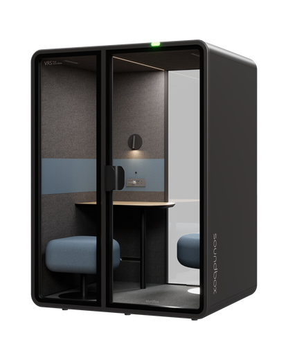 SoundBox VRS Comfort pod from the front right: wall lamp and control panel on the felt back wall, glass on the right of the back wall