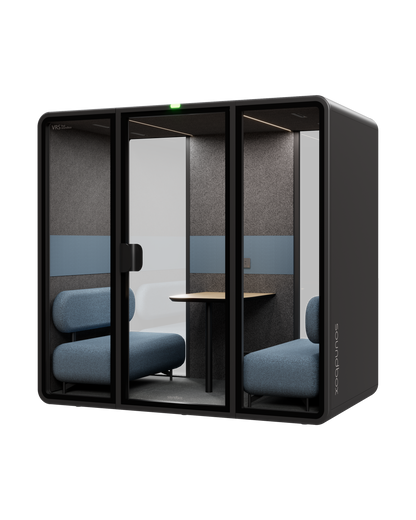 SoundBox VRS Double meeting pod: graphite shell, three glass panels with a centre door, dusty blue sofas and an oak table inside