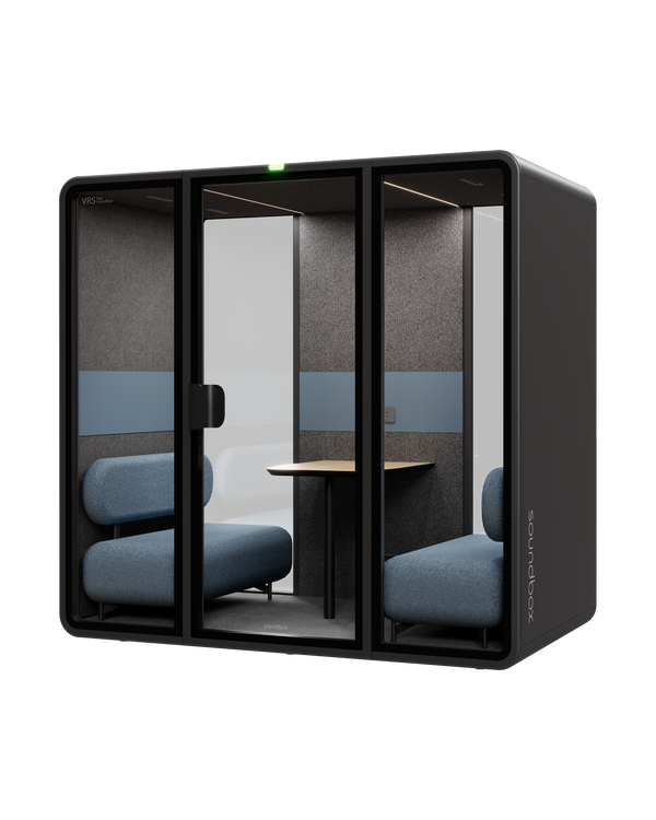 SoundBox VRS Double meeting pod: graphite shell, three glass panels with a centre door, dusty blue sofas and an oak table inside