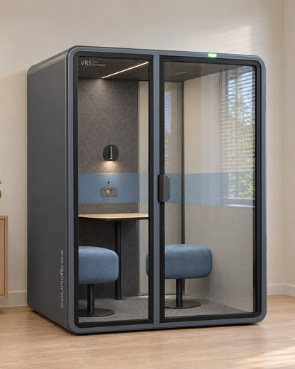 SoundBox VRS Comfort in a bright consulting office by a window, door closed, green available light on. Illustration.