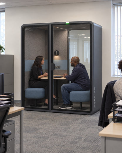SoundBox VRS Comfort in a municipal social services office, a caseworker and a client talking privately inside. Illustration.