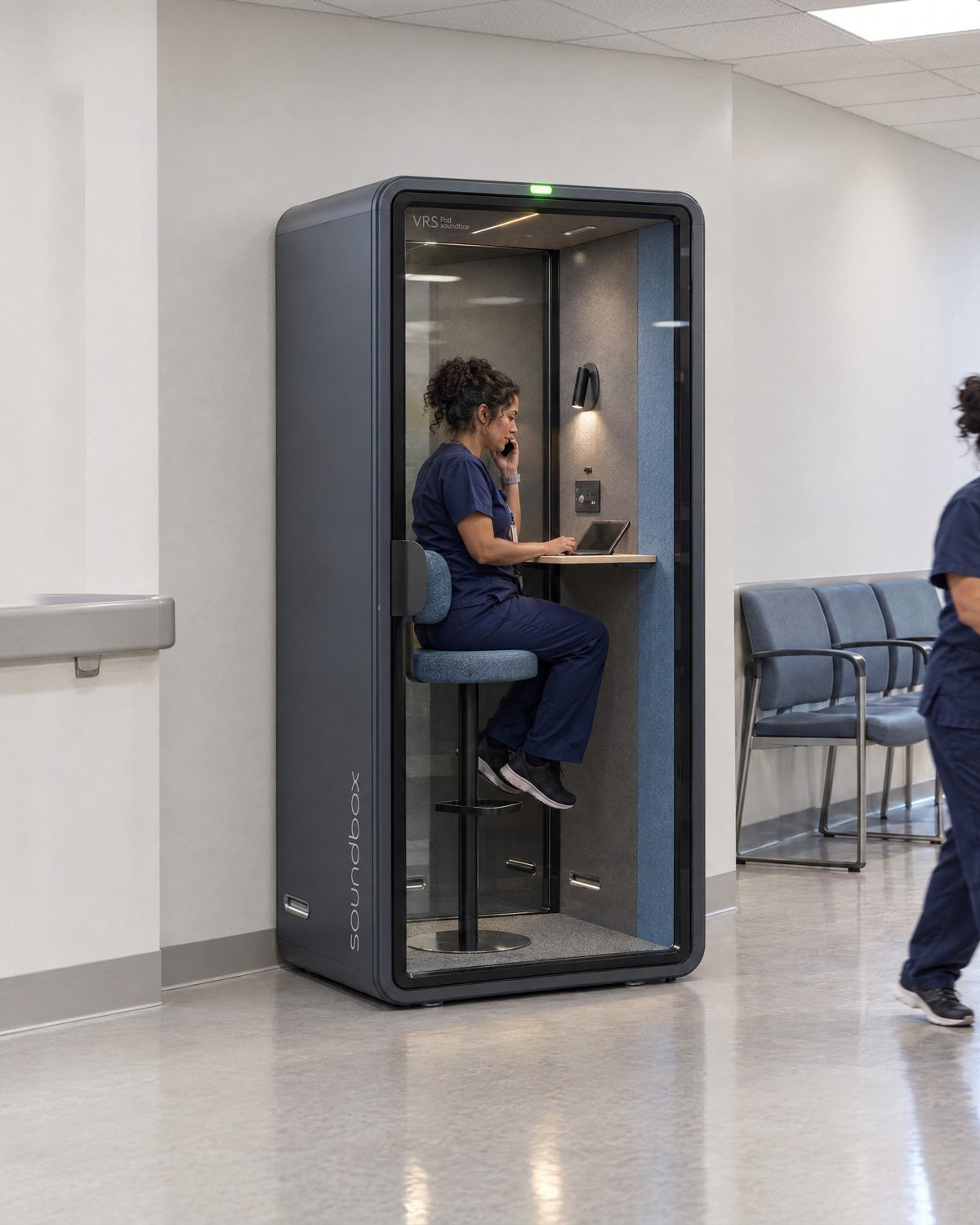 SoundBox VRS Single in a community health clinic, a nurse inside on a private phone call. Illustration.