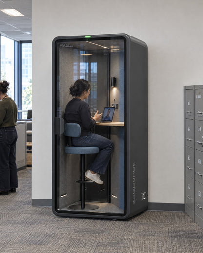 SoundBox VRS Single in a city permits office, a planner inside on a video call. Illustration.
