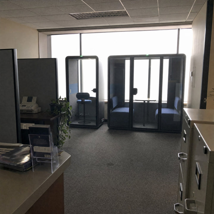 SoundBox VRS-S booth and VRS-ML pod against a brokerage window wall