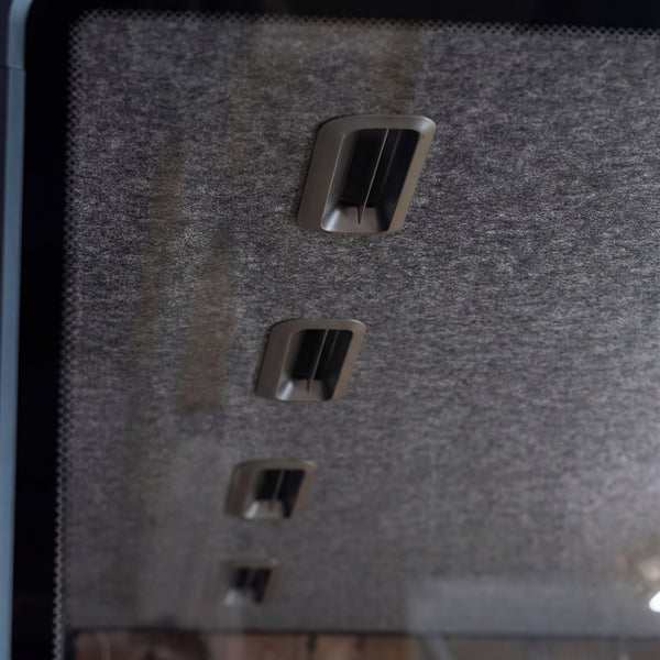 Ventilation outlets set into the acoustic felt panel inside a Quiet Cabins booth
