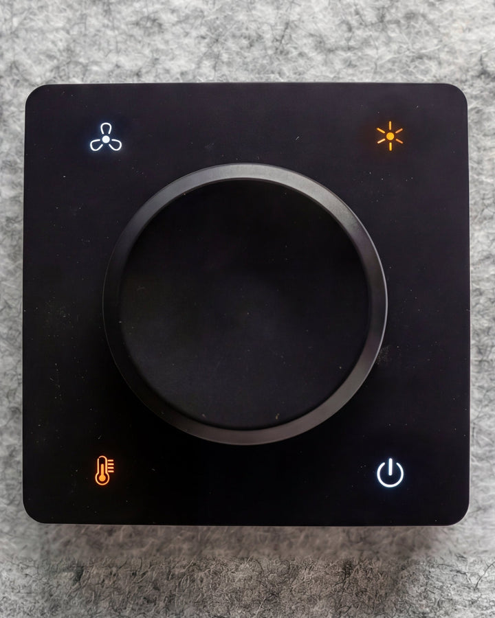 The fan and light dial inside every booth.